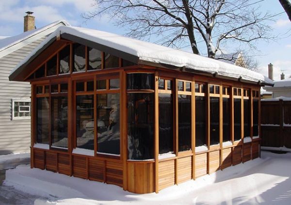 chalet gazebo with snow on the roof