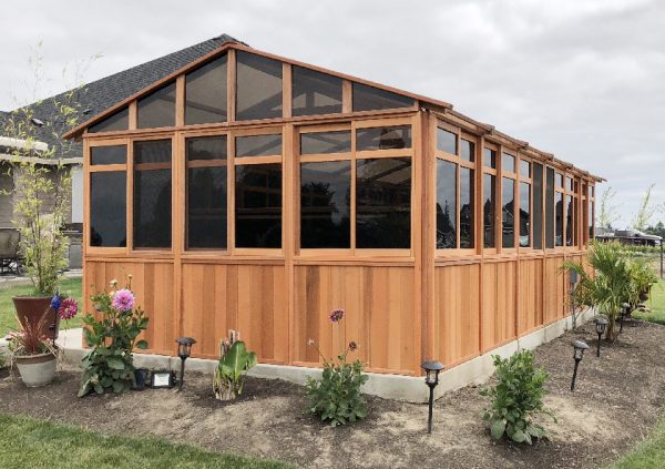 a gazebo with plants around