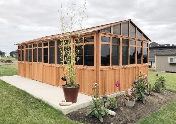 a gazebo with plants around