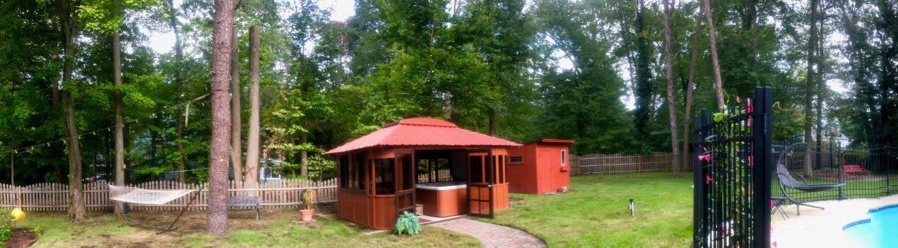 an Aspen hot tub enclosure in the backyard